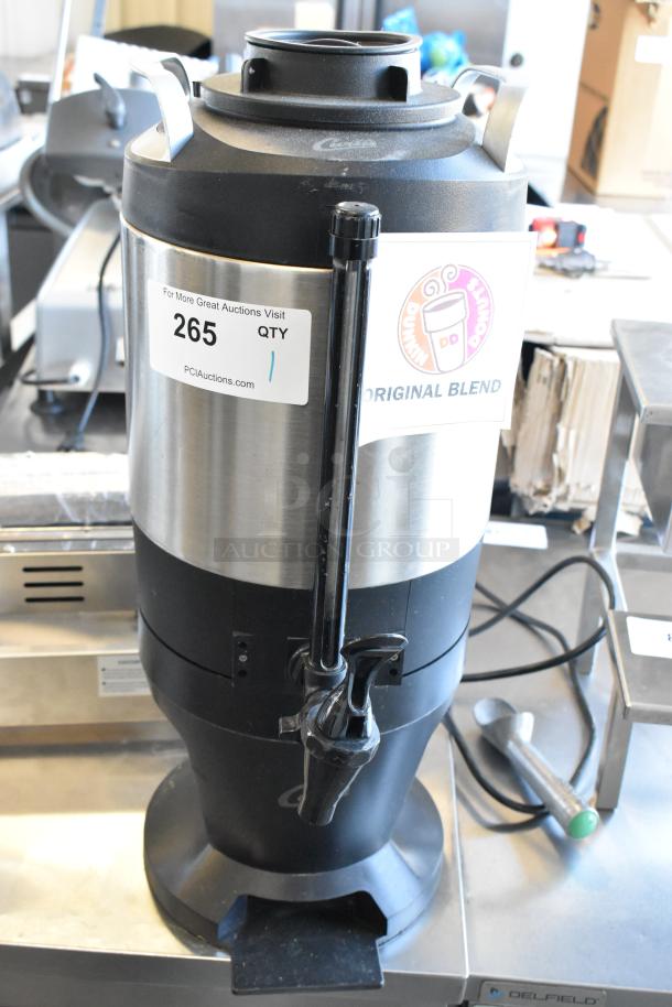 Curtis TXSG1501S600 stainless steel beverage dispenser, featuring durable construction, tap spout, and Dunkin' label.