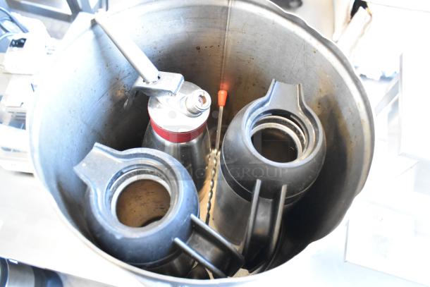 4-piece set: Curtis stainless steel beverage dispenser, two coffee pots, and whipped cream dispenser. Used condition.