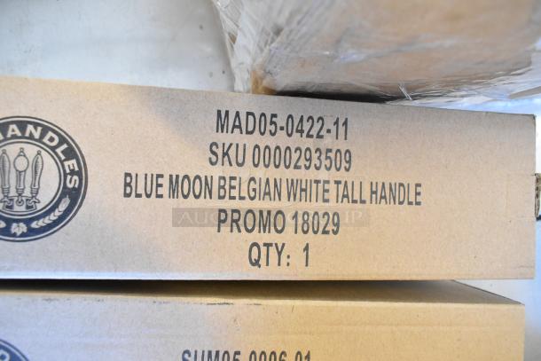 9 new tap handles in boxes, including models MS525, SUM-OKTT-2, MAD05-0422-11; Blue Moon Belgian White handle promo.