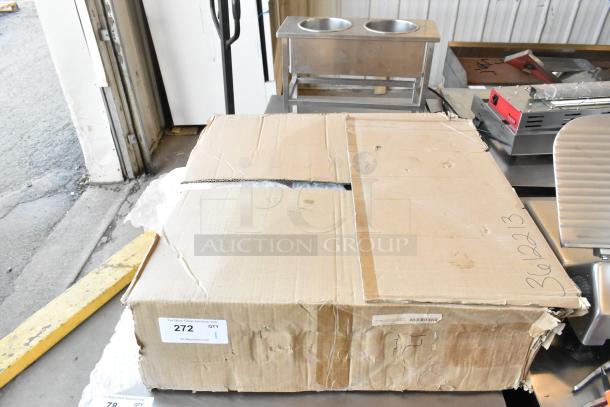 Cardboard box labeled "CaptiveAire DI-PSP-12-24X24 Diffuser" in warehouse. Box shows signs of wear. Visible auction label: "272 QTY 1."