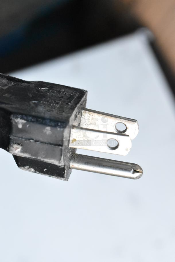 Close-up image of a power plug, potentially for Sharp R-3A55 Microwave, 120 Volts, 1 Phase. Possible wear visible.