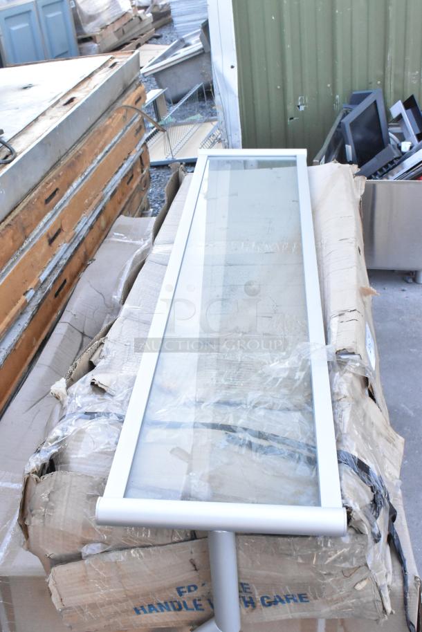 3 brand new scratch-and-dent items, including 600DDT60L 5' dirty dish table with a left drainboard, glass pane, on damaged packaging.