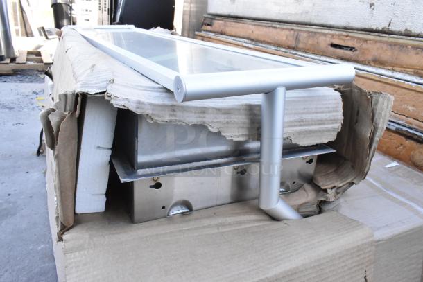 3 brand new scratch and dent items including a 600DDT60L 5' soiled dish table with left drainboard, glass pane on packaging.