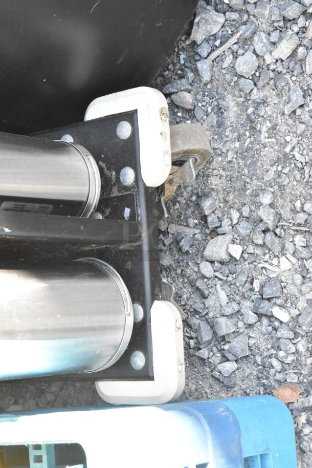 Metal 8 chute cup dispenser on commercial casters, featuring stainless steel design, sturdy base, and visible casters for mobility.