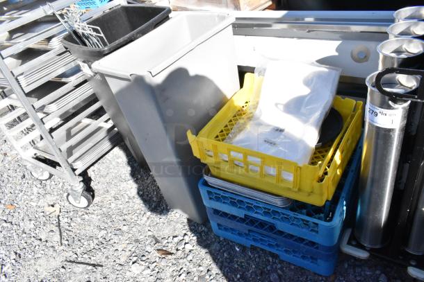 Lot of various items including poly glass racks, gray Slim Jim trash can, and metal cart on wheels. Good condition.