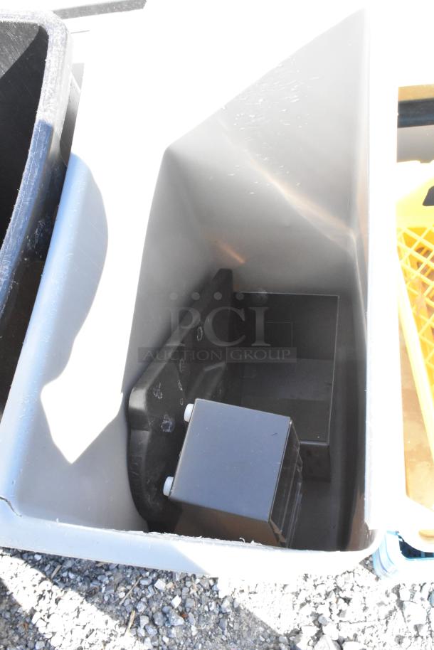 Lot of various items including poly glass racks and gray Slim Jim trash can, showing exterior and minor wear.