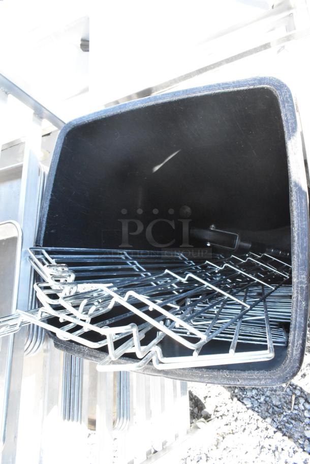 Lot with poly glass racks and Gray Slim Jim trash can, showing signs of wear. Includes assorted metal items.