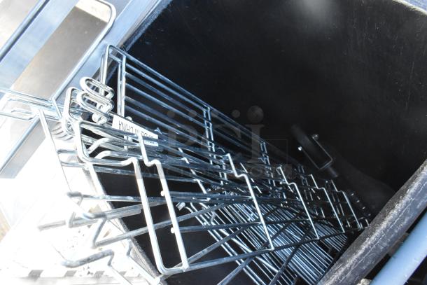 Lot includes poly glass racks and gray Slim Jim trash can. Features sturdy metal construction. Visible "Made in China" label.