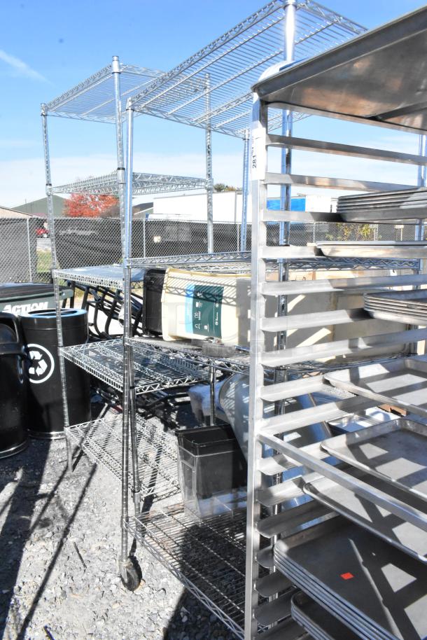 Chrome finish 4 tier wire shelving unit with contents on commercial casters, outdoor setting. Buyer must dismantle.