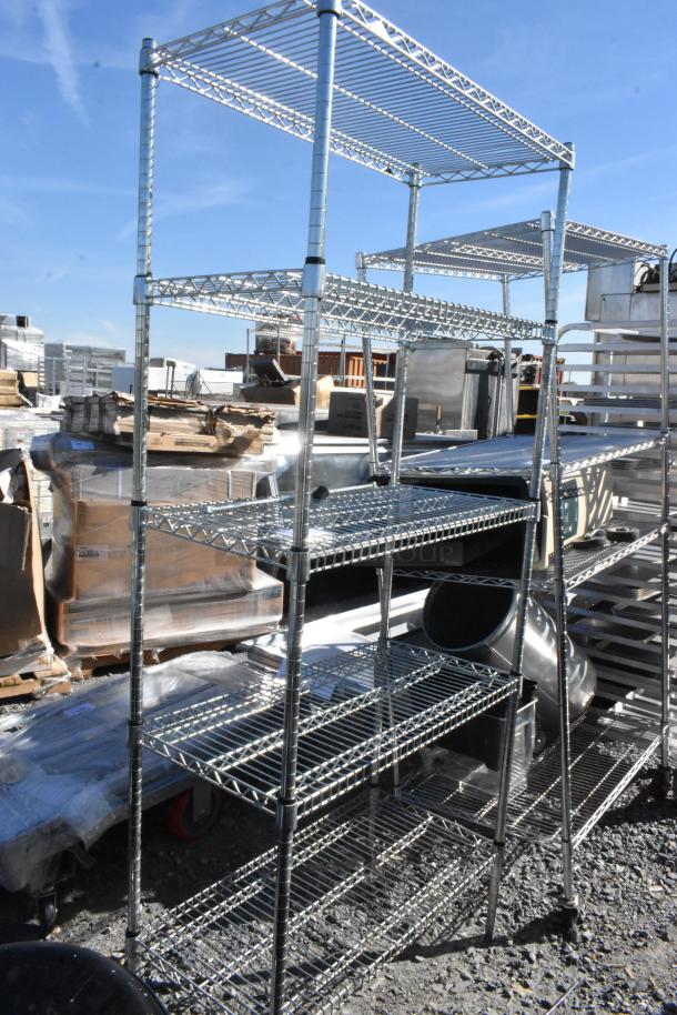 Chrome finish 5-tier wire shelving unit, industrial style, tall and spacious. Condition: Slightly used, outdoor setting.