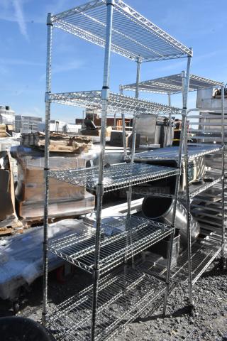 Chrome finish 5-tier wire shelving unit, industrial style, tall and spacious. Condition: Slightly used, outdoor setting.