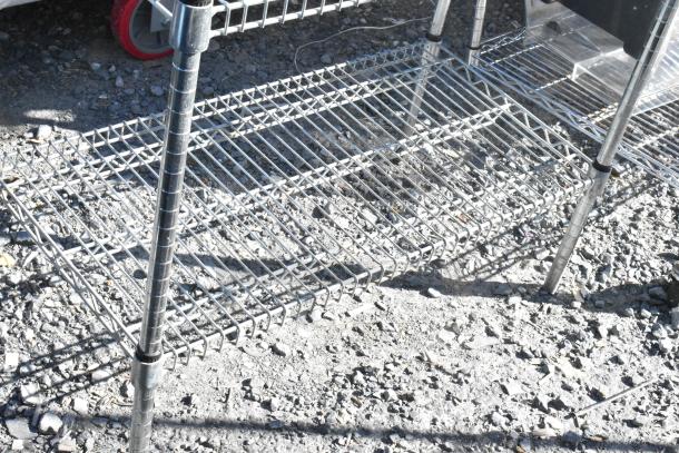 Chrome finish 5 tier wire shelving unit in good condition. Buyer must dismantle. Consider freight charges.