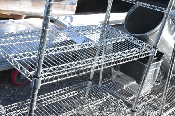 Chrome finish 5-tier wire shelving unit, sturdy metal construction, good condition. Buyer must dismantle. 
