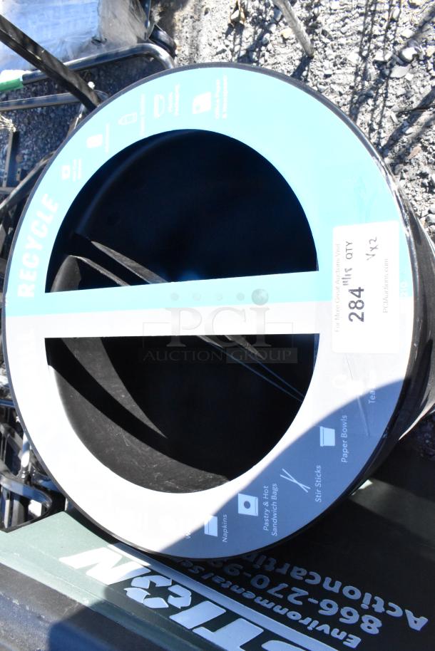 Recycle bin shell, black with blue "Recycle" label, includes sorting icons. Item 284, auction lot: 2 trash can shells.