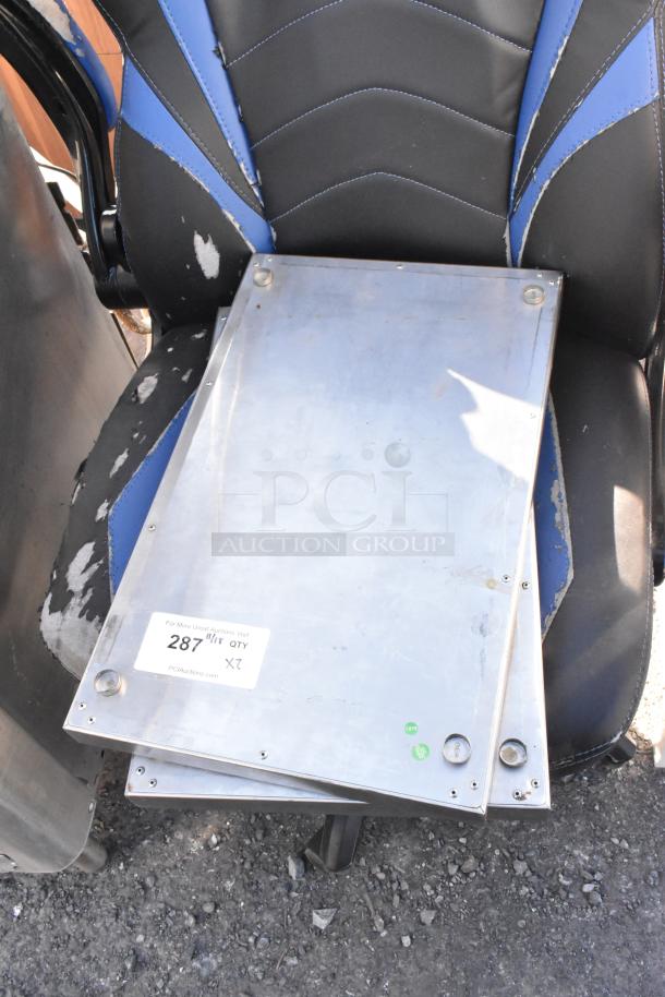 Two metal panels with attached hardware, visible label "287" and "X2," indicating a lot for auction bid multiplier.