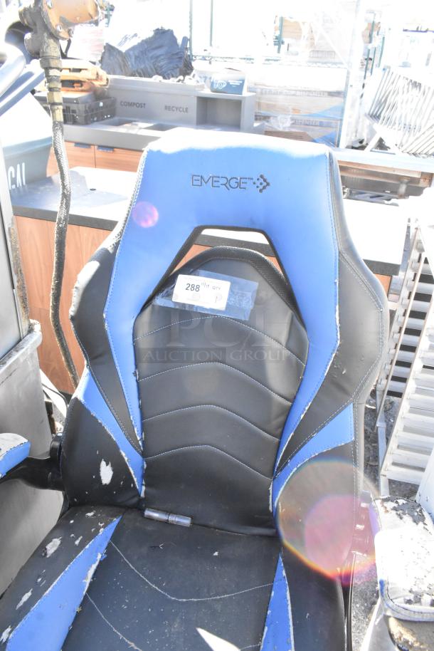 Emerge blue and black gaming chair on casters. Exhibits noticeable wear, with peeling surface. Label shows "288" marking.