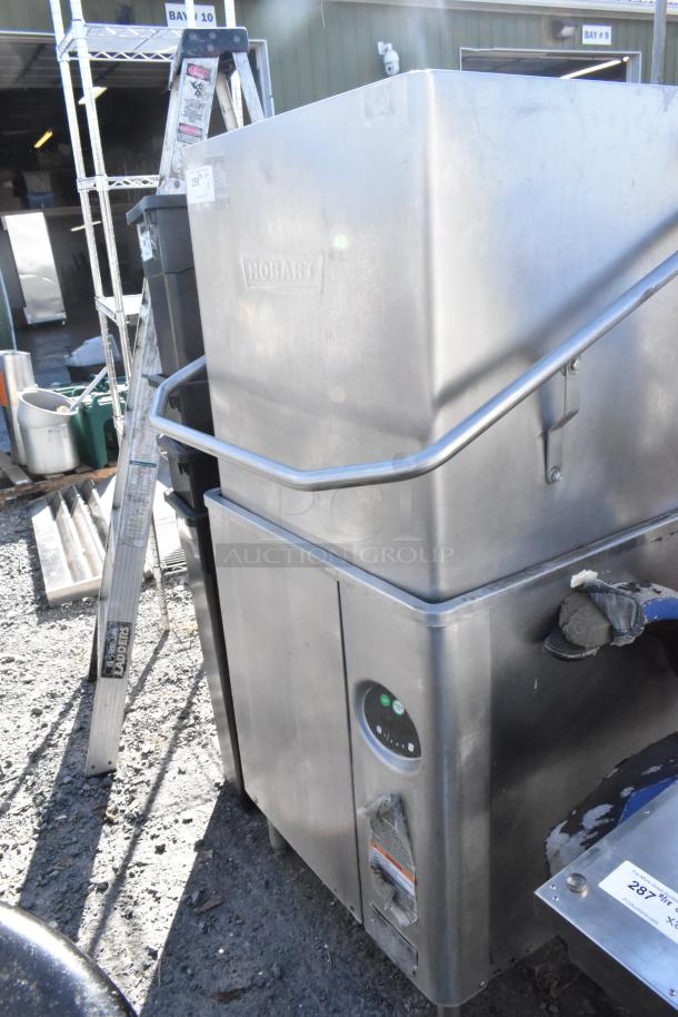 Hobart AM15 stainless steel commercial dishwasher, straight pass-through design. Features 480 volts, 3 phase power. Used condition.