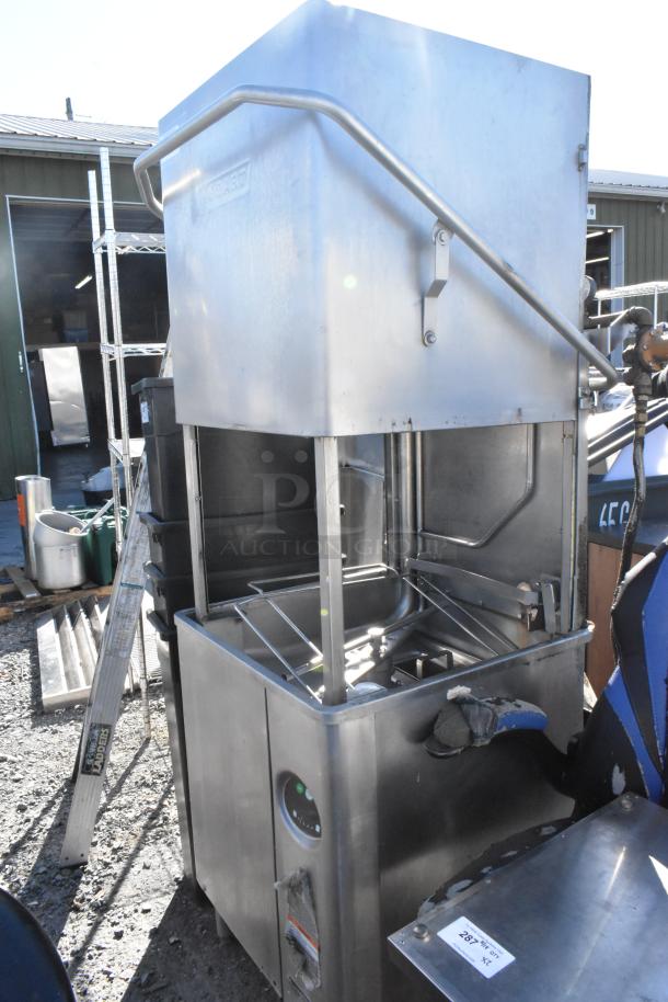 Hobart AM15 stainless steel commercial dishwasher, straight pass-through design, 480V, 3 phase, used condition.