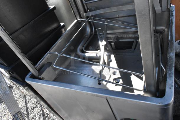 Hobart AM15 stainless steel commercial pass-through dishwasher, 480V, 3 Phase, visible interior components, good condition.