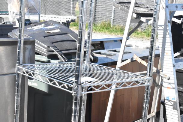 Chrome finish 5-tier wire shelving unit, requires dismantling for shipping, sturdy steel construction, excellent condition.