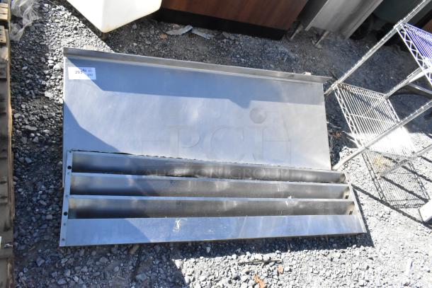 Two metal pieces: a wall mount shelf and kickplate for reach-in, in good condition. Label shows quantity details.