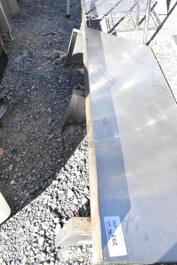 Two metal pieces including a wall mount shelf and kickplate for reach-in, with visible label "293 XZ AD 2X".