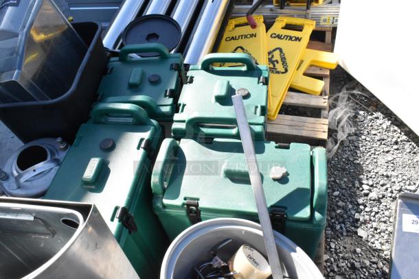 Pallet lot including metal trash can, green beverage dispensers, yellow wet floor caution signs. Mixed condition.