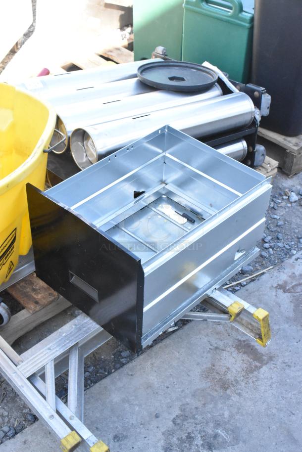 Pallet lot of items including a metal filing cabinet drawer, yellow caution sign, and aluminum ladder. Used condition.