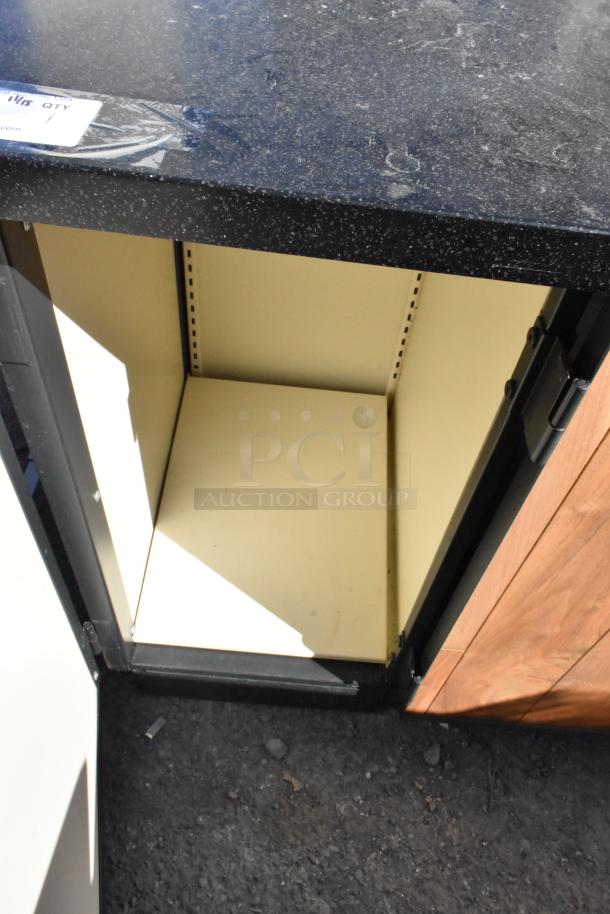 Wood pattern trash can shell with 2 deposit holes, black countertop, and 3 doors. Interior view shows open compartment.