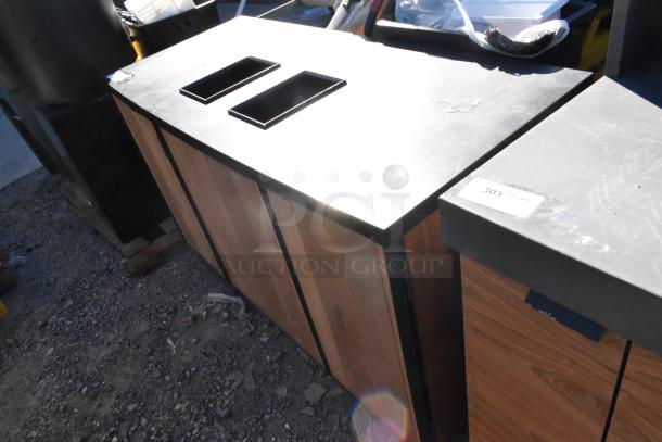 Wood pattern trash can shell with two trash deposit holes and three doors. Features a label marked "303." Appears in used condition.