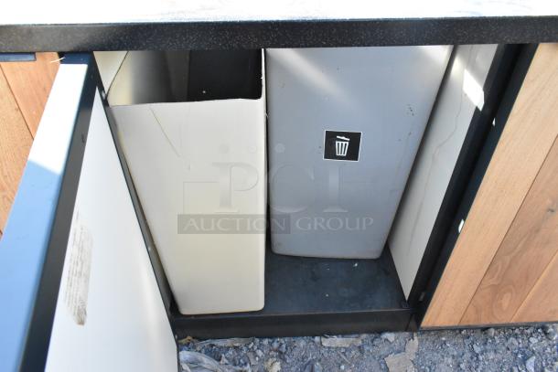 Wood pattern trash can shell with 2 deposit holes and 3 doors, featuring interior compartments. Condition: good.