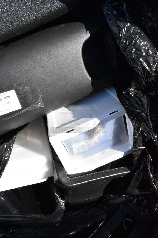 Pallet lot with black trash can, white bus bin in mixed condition; visible label indicates "V-Lot".