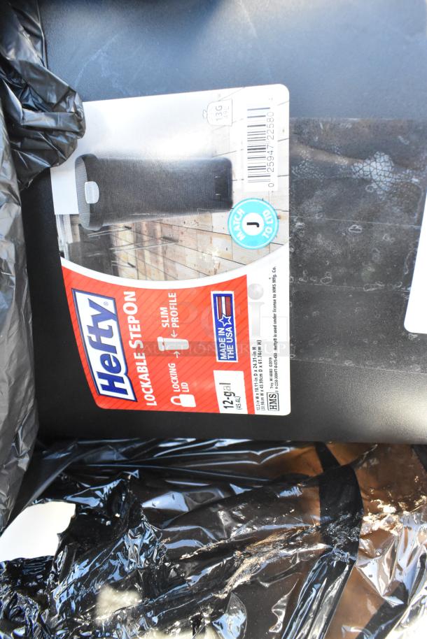 Hefty 12-gallon black lockable step-on trash can. Features locking lid, slim profile, Made in USA. Label visible.