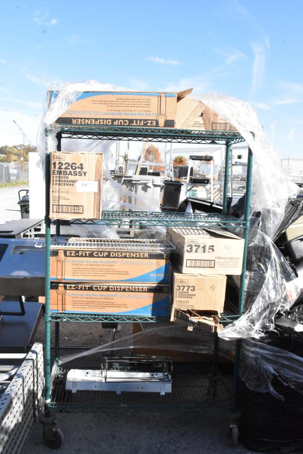 Green 4-tier wire shelving with EZ Fit Cup Dispensers, 3715 and 3773 Libbey glasses in labeled boxes. Buyer dismantles.