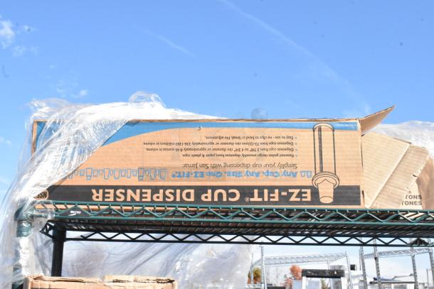 Green finish 4-tier wire shelving unit with EZ Fit cup dispensers and Libbey glasses. Buyer must dismantle.