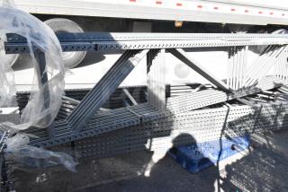 Lot of gray metal pallet racking pieces, 25x3x144.5, new condition. Ideal for warehouse storage solutions.