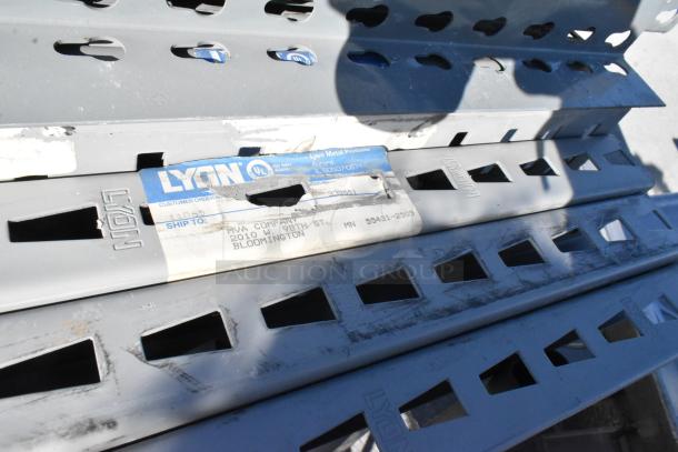 Lot of gray metal pallet racking pieces, size 25x3x144.5, branded Lyon. Includes visible label indicating shipping info.