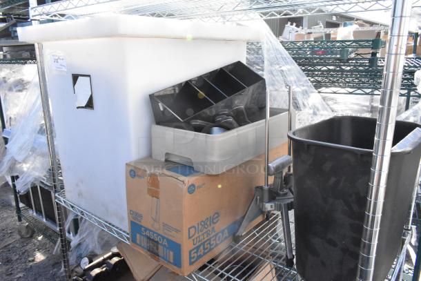 Chrome 3-tier wire shelving with contents: trash bin, Libbey tall beer glasses, Dixie Ultra 54550A dispenser, to be dismantled by buyer.