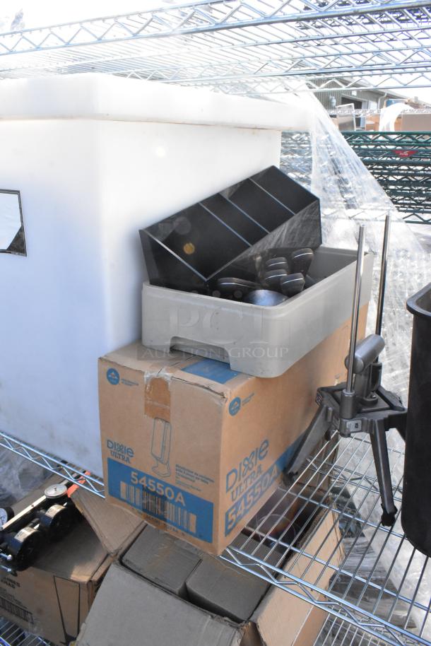 Chrome 3-tier wire shelving unit with trash bin, Libbey beer glasses, Dixie Ultra 54550A dispenser, DIY dismantle required.