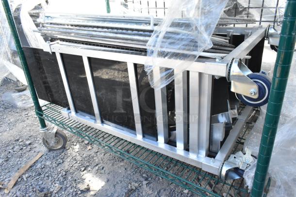 Green 4-tier wire shelving unit with metal shelves, wheels, and contents. Buyer must dismantle. Consider freight charges.