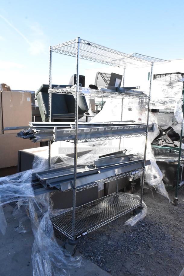 Chrome finish 4-tier wire shelving unit on casters with labeled metal pieces. Buyer must dismantle. Consider freight charges.