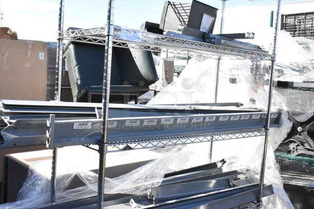 Chrome 4-tier wire shelving on casters, includes metal pieces. Dismantling required. Consider freight charges.