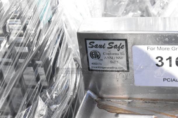 Stainless Steel Drain Board with under shelf, marked "Sani Safe." Conforms to ANSI/NSF Std 2, by Klinger's Trading. Visible labels.