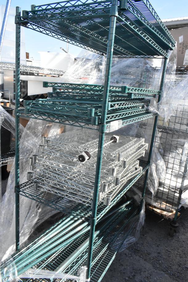 Green 4-tier wire shelving unit on commercial casters, includes contents. Buyer to dismantle. Consider freight shipping.
