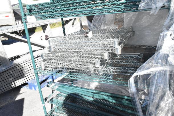 Green 4-tier wire shelving unit with commercial casters, includes contents. Shelves are partially disassembled.