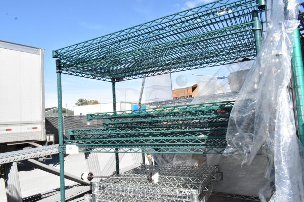 Green 4-tier wire shelving unit with contents, on commercial casters. Buyer must dismantle. Consider freight charges.