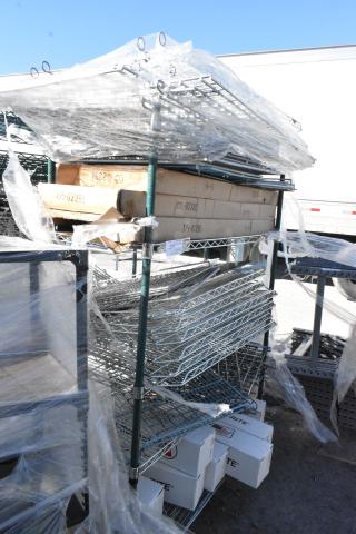 Chrome and green 5-tier wire shelving unit on casters with contents. Includes boxed items. Buyer must dismantle.