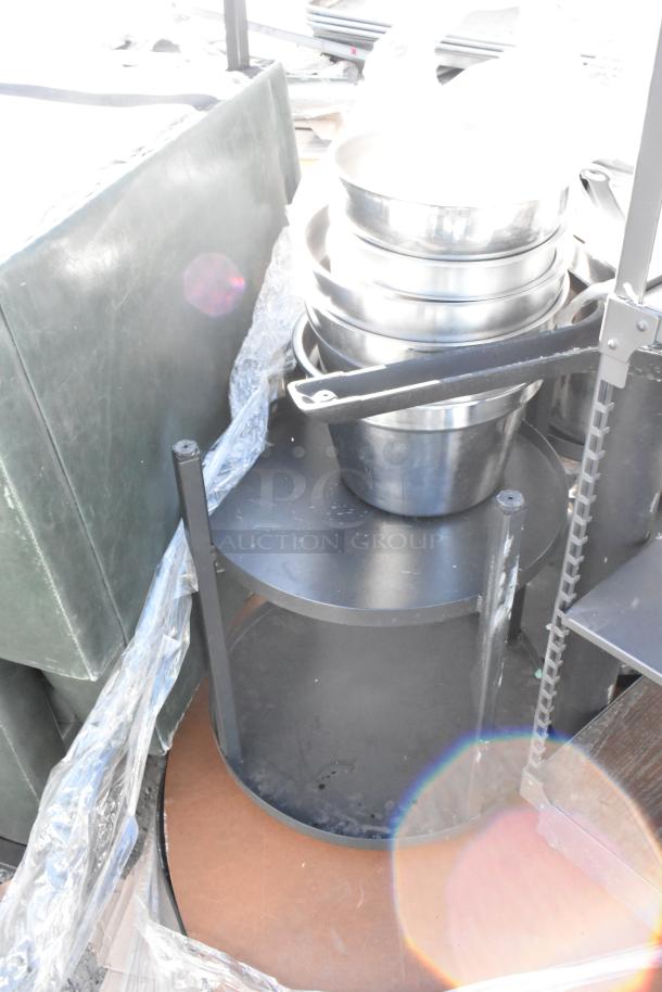 Pallet lot with metal bowls, black cart, and round tabletop. Items appear gently used, various materials visible.