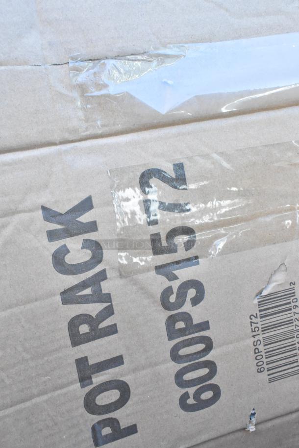 Cardboard packaging labeled "POT RACK 600PS1572." Visible tear on the side, sealed with tape.