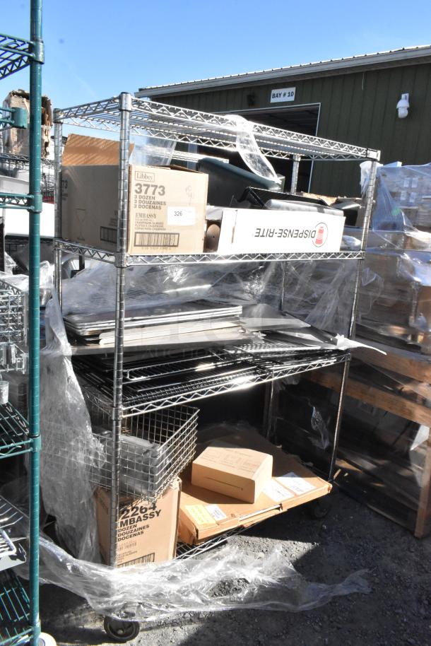 Chrome finish 4-tier wire shelving unit with boxes labeled "Libbey 3773" and "Dispense-Rite," including contents like glasses.